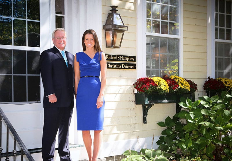Attorneys Richard S. Humphrey and Christina Dzierzek standing outside The Law Offices of Richard S. Humphrey.